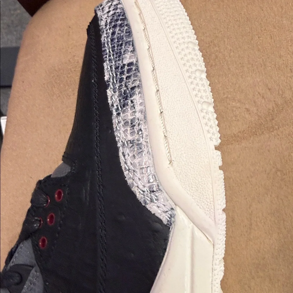 Jordan Low-Top Sneakers in Black with Red, Yellow, and Green Accents